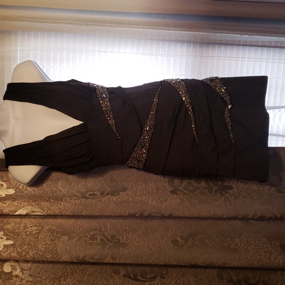 Black sleeveless mini dress with silver sequins